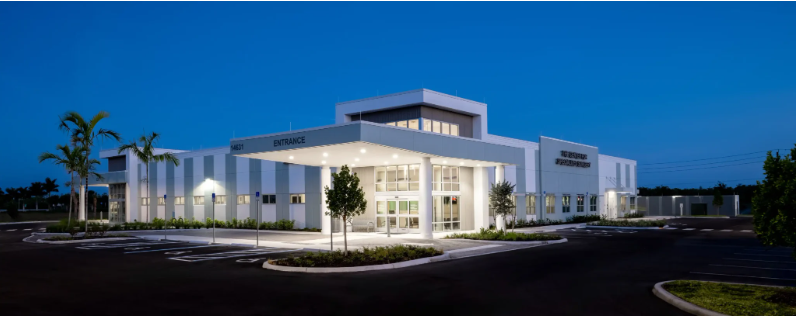 A picture of the surgical center with a dark sky